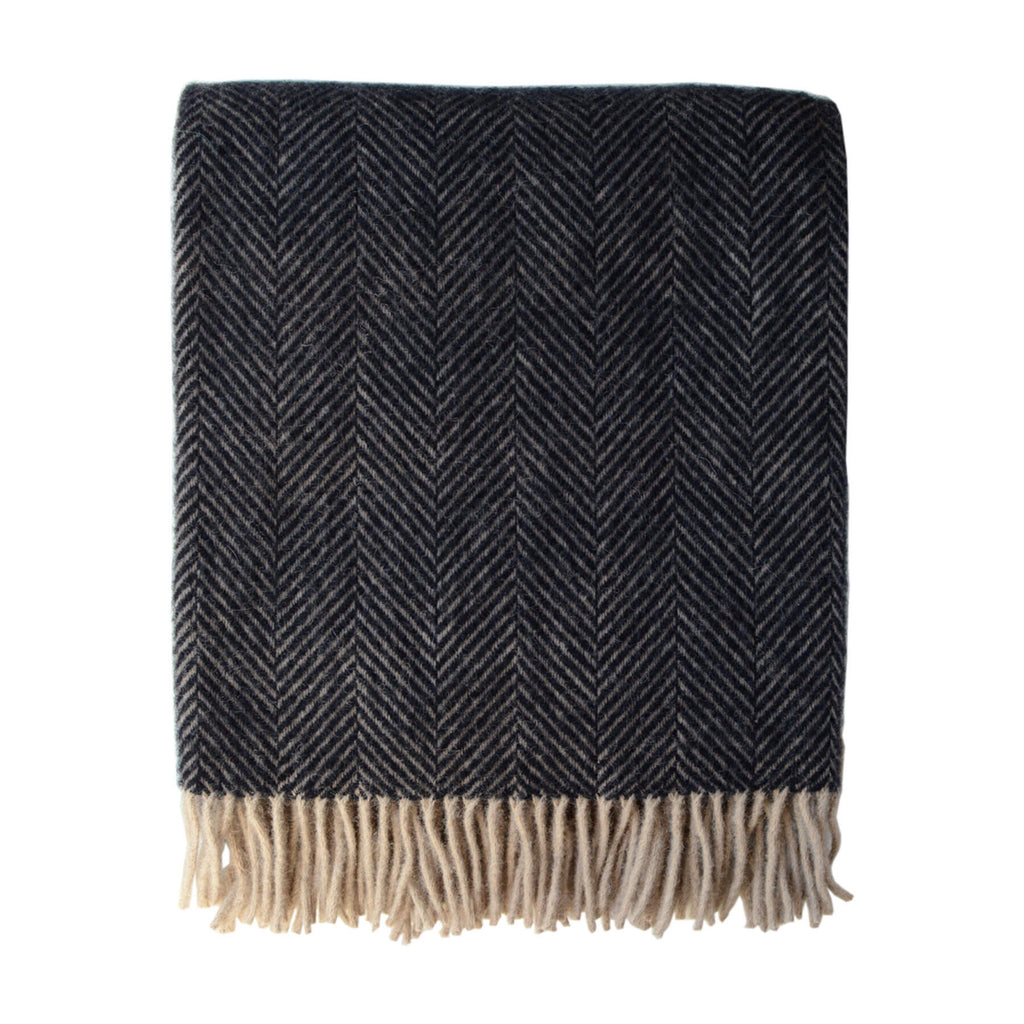 A dark brown wool throw with a herringbone pattern and fringe, on a white background.