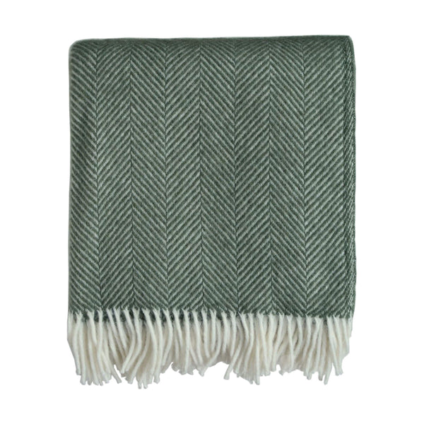 An olive green Tweedmill herringbone wool throw with an ivory fringe, shown on a white background.