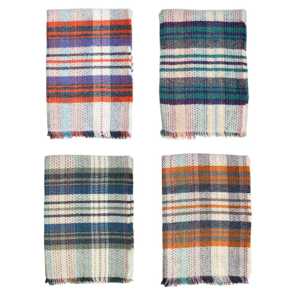 Four recycled wool Tweedmill blankets shown on a white background.